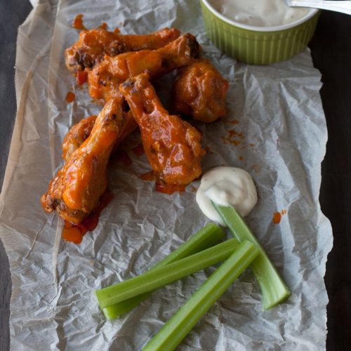 Buffalo hot chicken wings with blue cheese dressing and celery sticks…perfect football food!