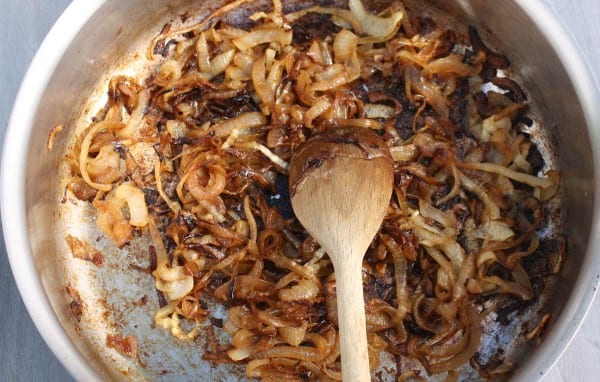 How to caramelize onions. Cook them slowly over a medium-low flame. A little sugar helps the caramelization process. 