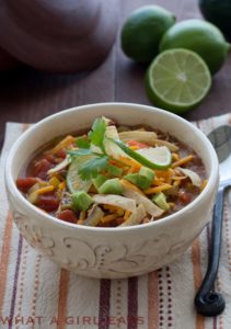 Chicken Tortilla Soup is a great way to stretch leftover rotisserie chicken, feeding your family dinner for a second night! | Recipe on WhatAGirlEats.com
