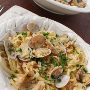 Pasta al Vongole, also known as linguine with clam sauce, is an Italian pasta dish, made with tender sauteed clams and a flavorful white wine sauce. It is quick and easy to prepare, making it perfect for a weeknight dinner. | from @whatagirleats