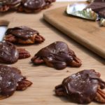 Sea Salt Caramel Pecan Turtles - The perfect candy to make and give as holiday food gifts, or to snack on any time of the year! Recipe on WhatAGirlEats.com