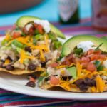 Mexican style chicken, flavored with cilantro and lime, served on crispy corn tortillas. This easy slow cooker recipe comes together quickly, making a healthy, hearty, family friendly meal. | WhatAGirlEats.com