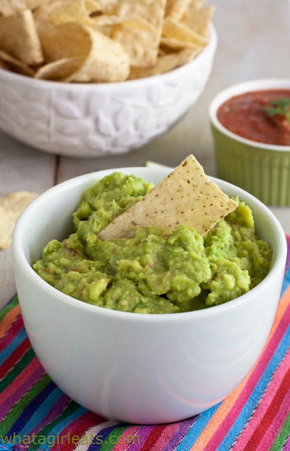 This homemade guacamole recipe uses fresh avocado, diced tomatoes, chile peppers, onion, and Mexican seasonings. Super easy, very fresh, and completely authentic!
