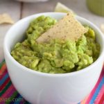 This homemade guacamole recipe uses fresh avocado, diced tomatoes, chile peppers, onion, and Mexican seasonings. Super easy, very fresh, and completely authentic! | What A Girl Eats