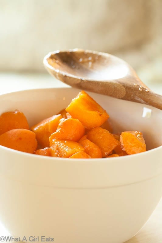 Apricots in stoneware bowl.