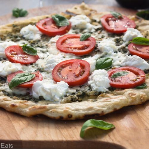 Grilled pizza with pesto, ricotta and smoked mozzerella.