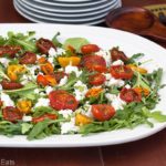 Moonblush Tomato Salad is the perfect light meal, using fresh garden tomatoes, healthy arugula, mint, and creamy goat cheese! | from @whatagirleats