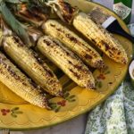 Mexican style corn on the cob, made with chile-lime Parmesan butter, is one of the most delicious ways to eat grilled corn on the cob. | @whatagirleats