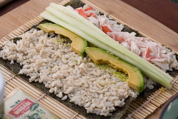 Cucumber and avocado added on top of the rice.