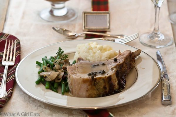 Rack of pork is an elegant dinner, perfect for special occasions, but easy enough to make for a special Sunday supper. With a serving of green peppercorn sauce, this meal is absolutely delicious! | What a Girl Eats