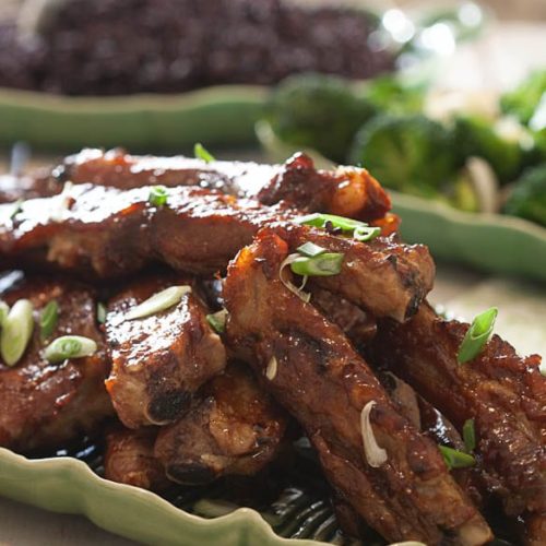 ﻿Sweet and spicy spare ribs ﻿are a homemade take on an Asian takeout classic. Tangy sweet with a little kick of spice, they're the perfect appetizer or main dish dinner! | What a Girl Eats