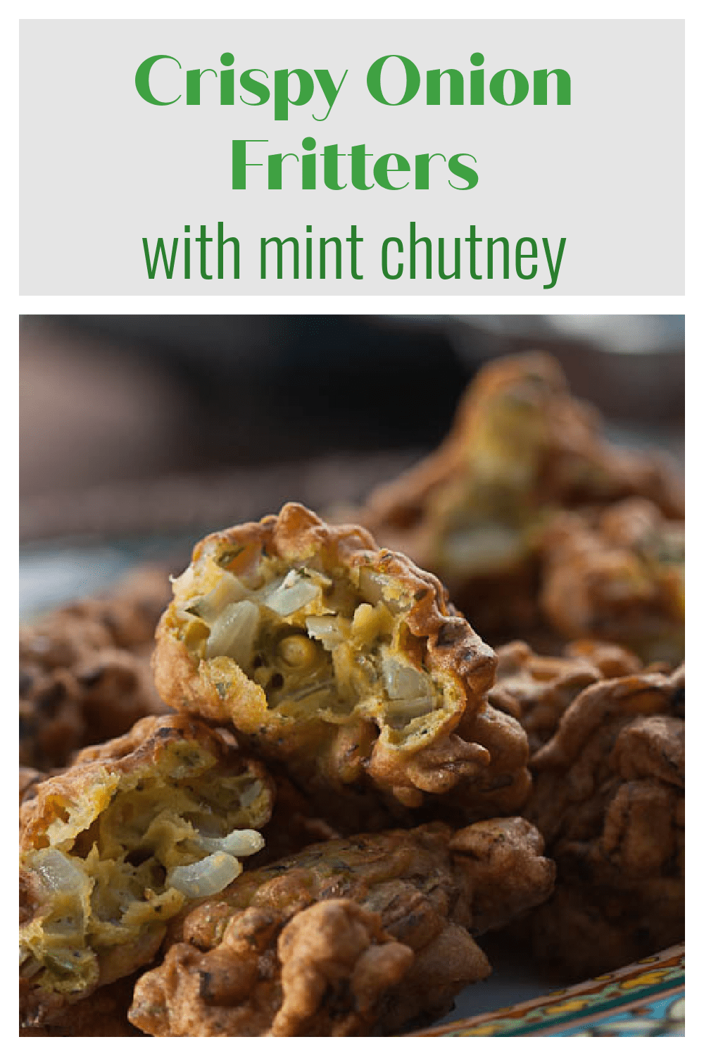 Onion fritters with cilantro mint dipping sauce are a delicious appetizer or snack. Serve with cilantro mint chutney.