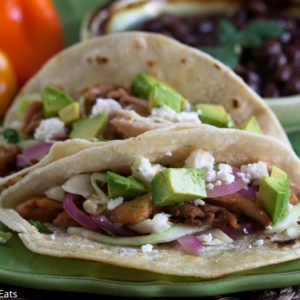 Chicken Tacos with Pickled Onion and Cilantro Slaw are a quick and easy, healthy taco dinner with a taste a step above the ordinary taco. | @whatagirleats
