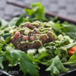 Tuna Tartare with Avocado Wasabi Cream on a bed of baby greens﻿ is a perfect weeknight dinner. Light and refreshing, this Five Happiness Salad is restaurant quality, made at home. | WhatAGirlEats.com
