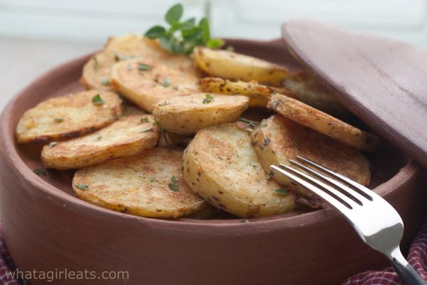 If you've been searching for the Crispiest Roasted Potatoes ever, look no further! This is the recipe for you! Add garlic, herbs and feta for a Greek Version! | WhatAGirlEats.com