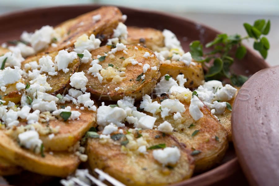 Greek style garlic roasted potatoes with feta.