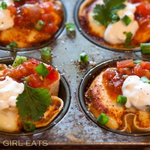 Mexican egg cups are a delicious, gluten free brunch treat, made with fluffy eggs, salsa, cheese and spices, baked inside of corn tortillas. | WhatAGirlEats.com