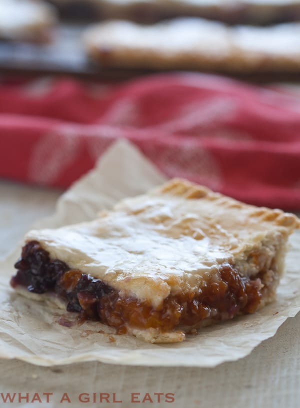 Apricot-cherry slab pie is a portable dessert, with a buttery, flaky crust and fresh spring fruit filling. It's perfect picnic food. - Recipe on WhatAGirlEats.com