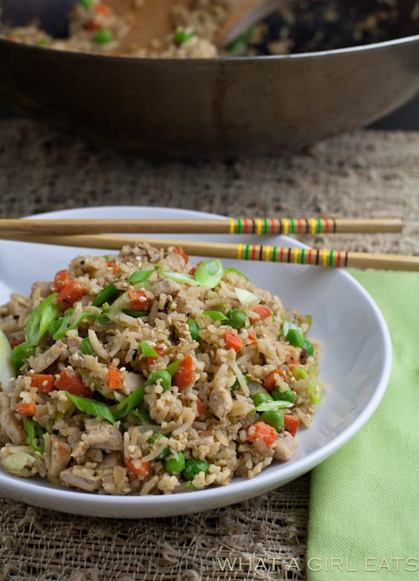 Pork fried rice is a flavorful Asian dish, packed with tender rice, bite sized pieces of pork, and crisp vegetables. Making it at home is incredibly quick and easy to do! | From @whatagirleats