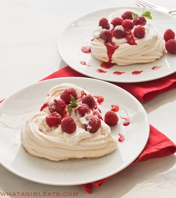 two heart shaped meringues on red napkins