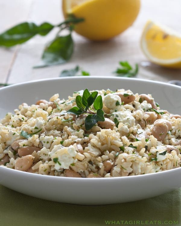 Mediterranean cold rice salad in a white bowl. 