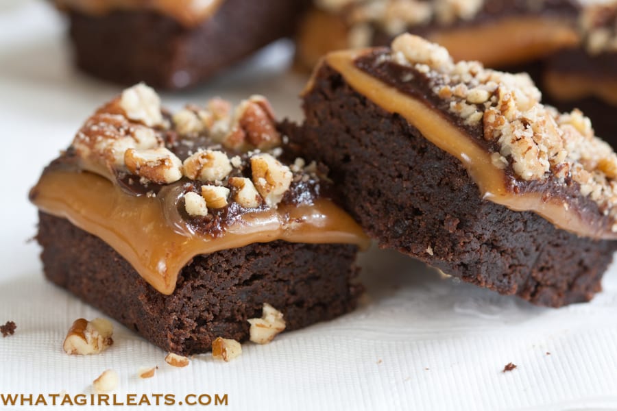 Millionaire Brownies, classic brownies layered with caramel, ganache and chopped nuts. @whatagirleats. com