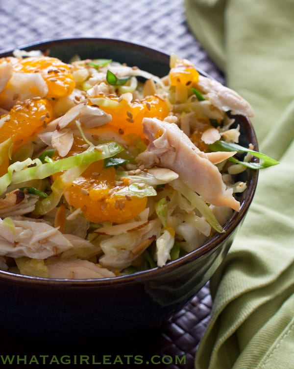 Chinese Chicken Salad, crisp cabbage, shredded chicken in a slightly sweet dressing with sliced almonds and mandarin oranges.@whatagirleats.com