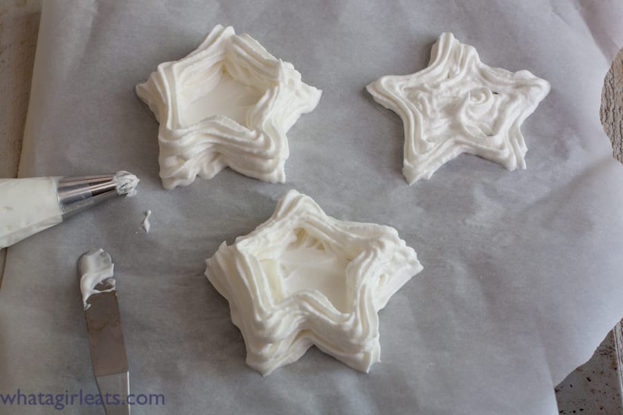  star meringues, pipe around the star shape, filling in the bottom first, then the sides.