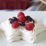 Star meringues, "spangled" with a dazzling display of bright, fresh berries. Star spangled meringues are a patriotic holiday dessert that will impress your guests! - Recipe on WhatAGirlWants.com
