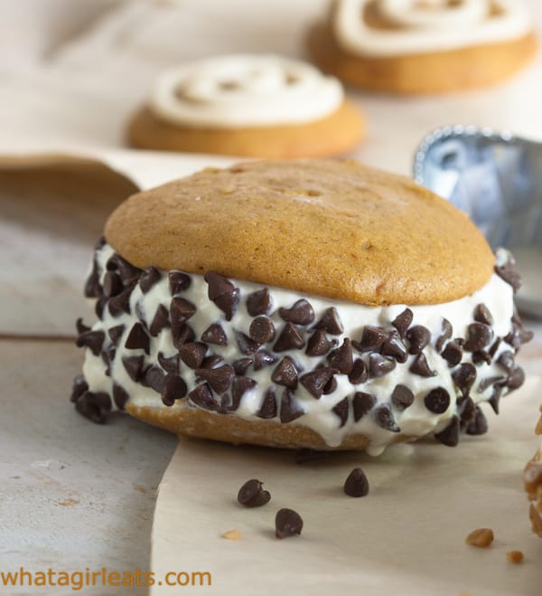 Pumpkin ice cream sandwiches with vanilla ice cream and chocolate chips.