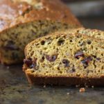 Moist and tender Pumpkin Cranberry Bread with Walnuts and a hint of autumn spices. | Recipe on WhatAGirlEats.com