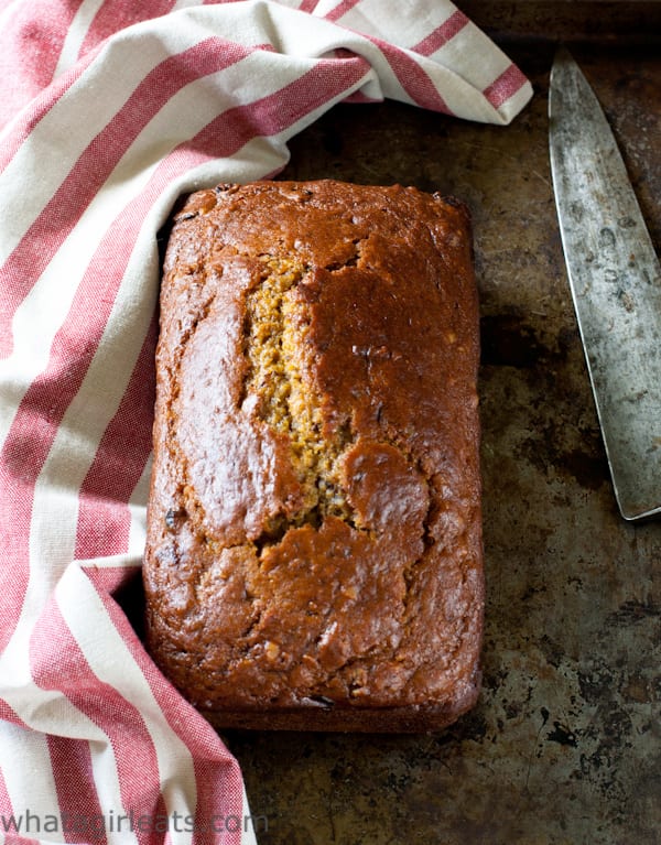 Moist and tender Pumpkin Cranberry Bread with Walnuts and a hint of autumn spices. | Recipe on WhatAGirlEats.com