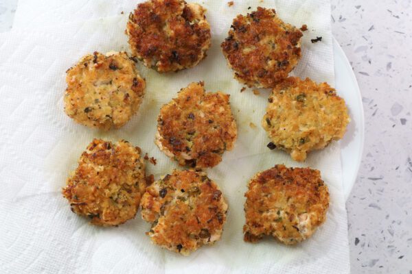 salmon cakes on paper towel.