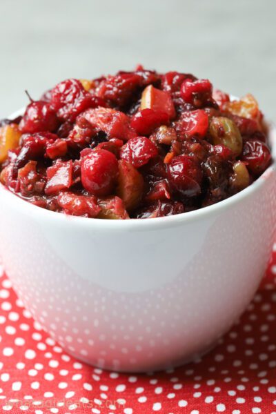 apple cranberry chutney in white bowl.