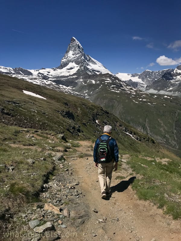 Our Swiss guide walking on trail.