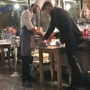 Chef and waiter serving