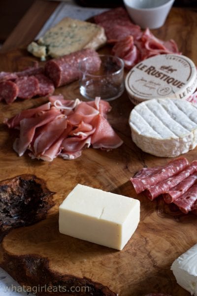 Meats and cheeses to start a charcuterie board.