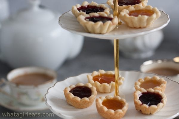 Jam tarts on a tiered serving tray.