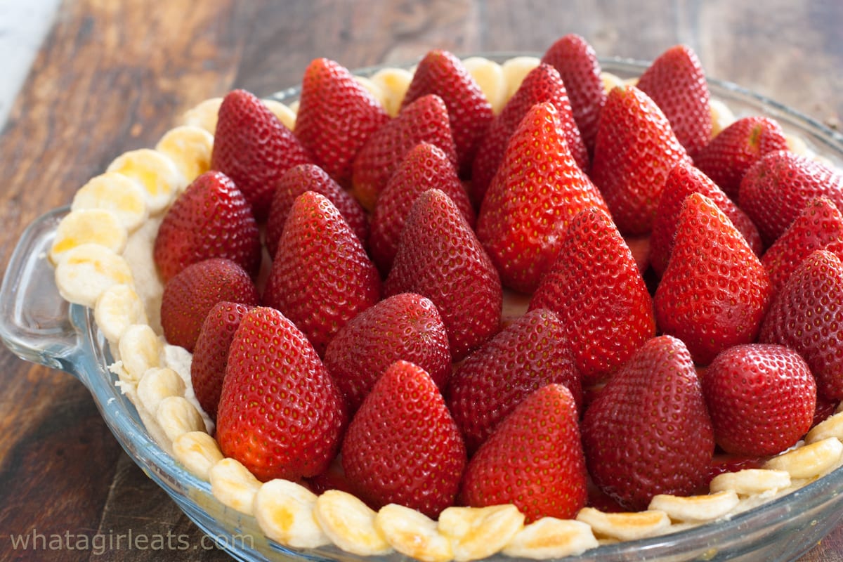 Whole strawberries placed on top of pie.