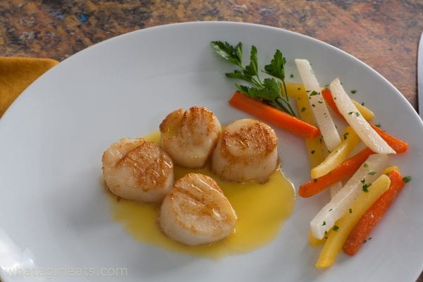 scallops with sauteed vegetables.