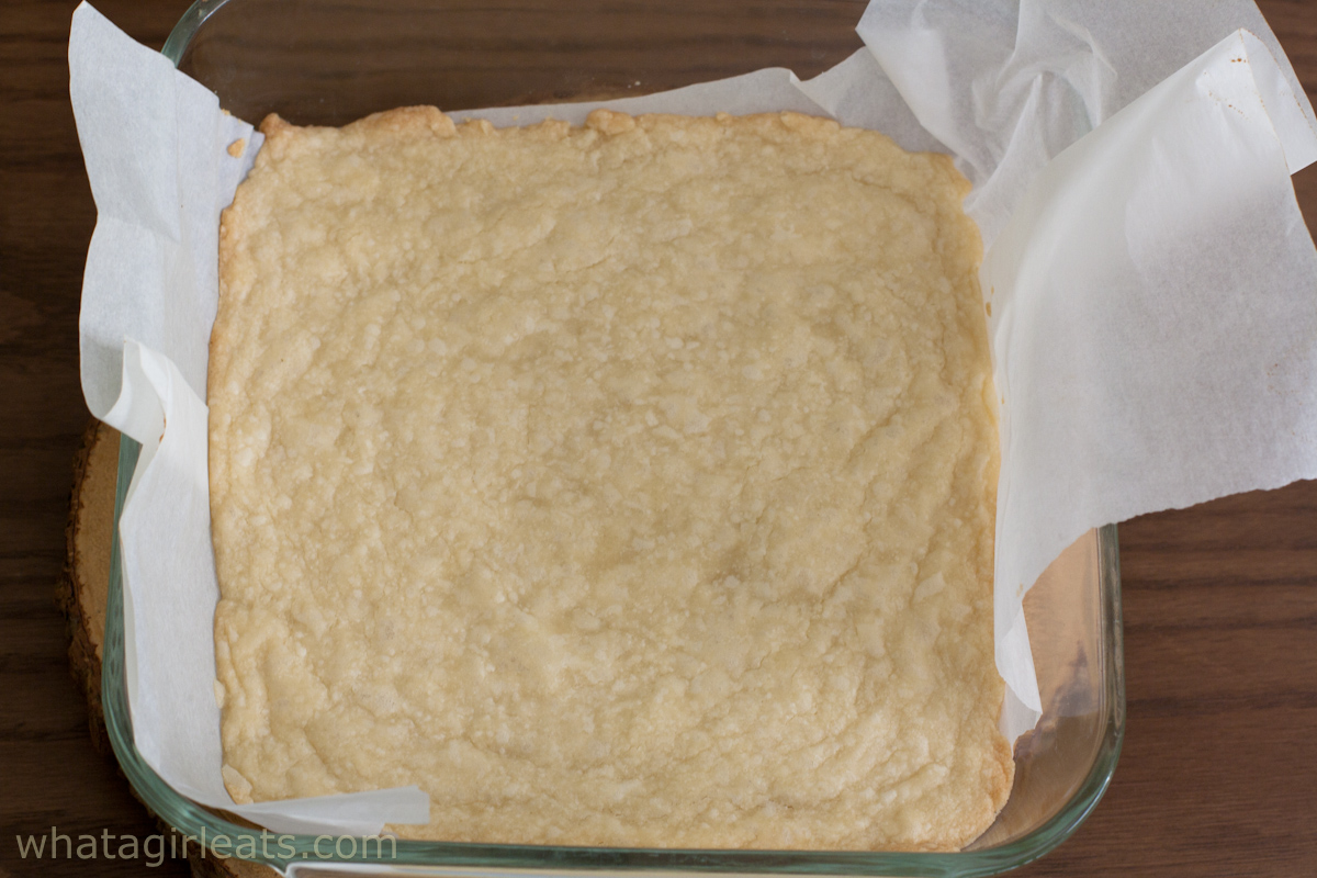 Baked crust in a pan lined with parchment paper.