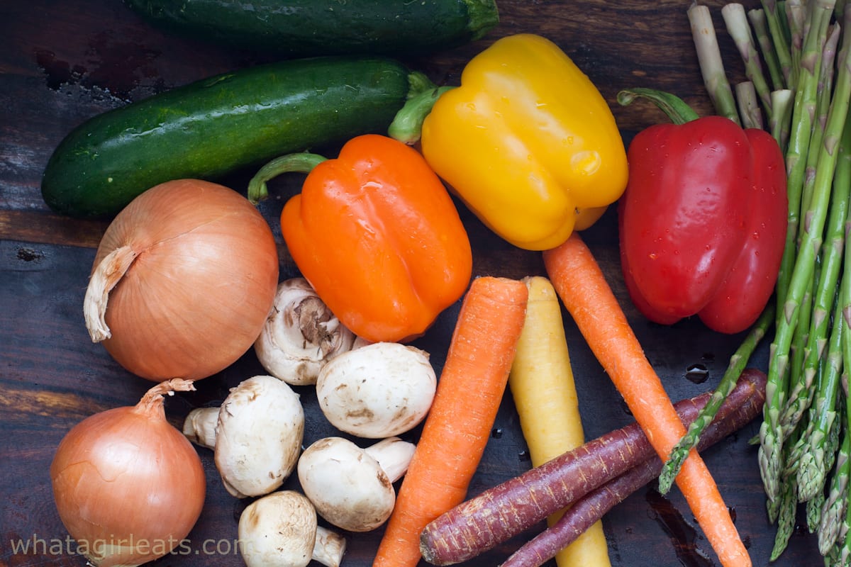 Raw vegetables on cutting board.