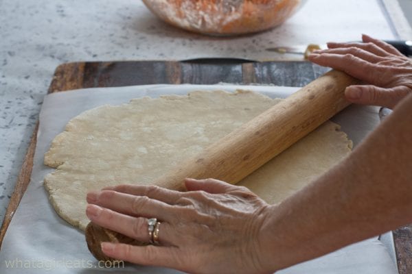 Rolling pie dough.