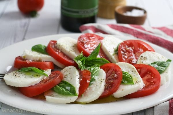 caprese salad on white plate.