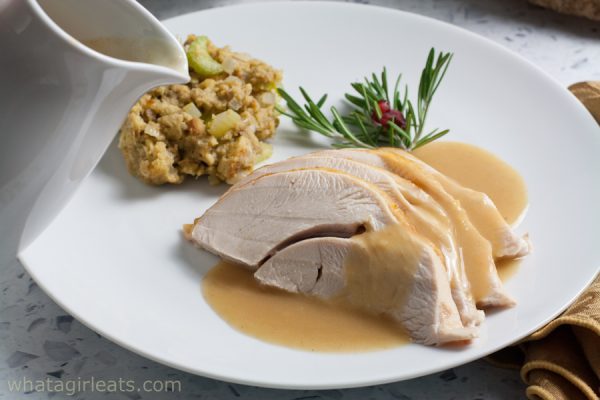 Stuffing and turkey on a plate.