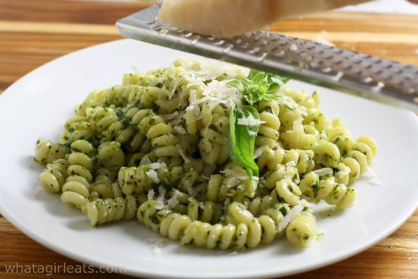 Pesto pasta with grated cheese.