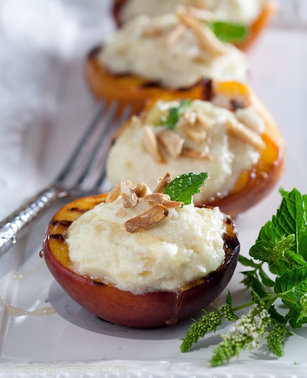 Grilled peaches with Mascarpone on a plate.