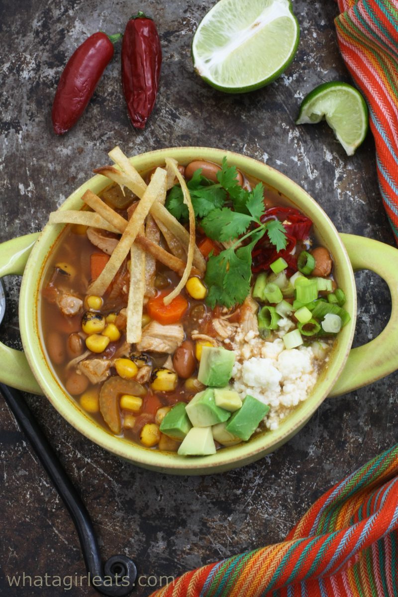 Top shot of Mexican chicken soup in a bowl.
