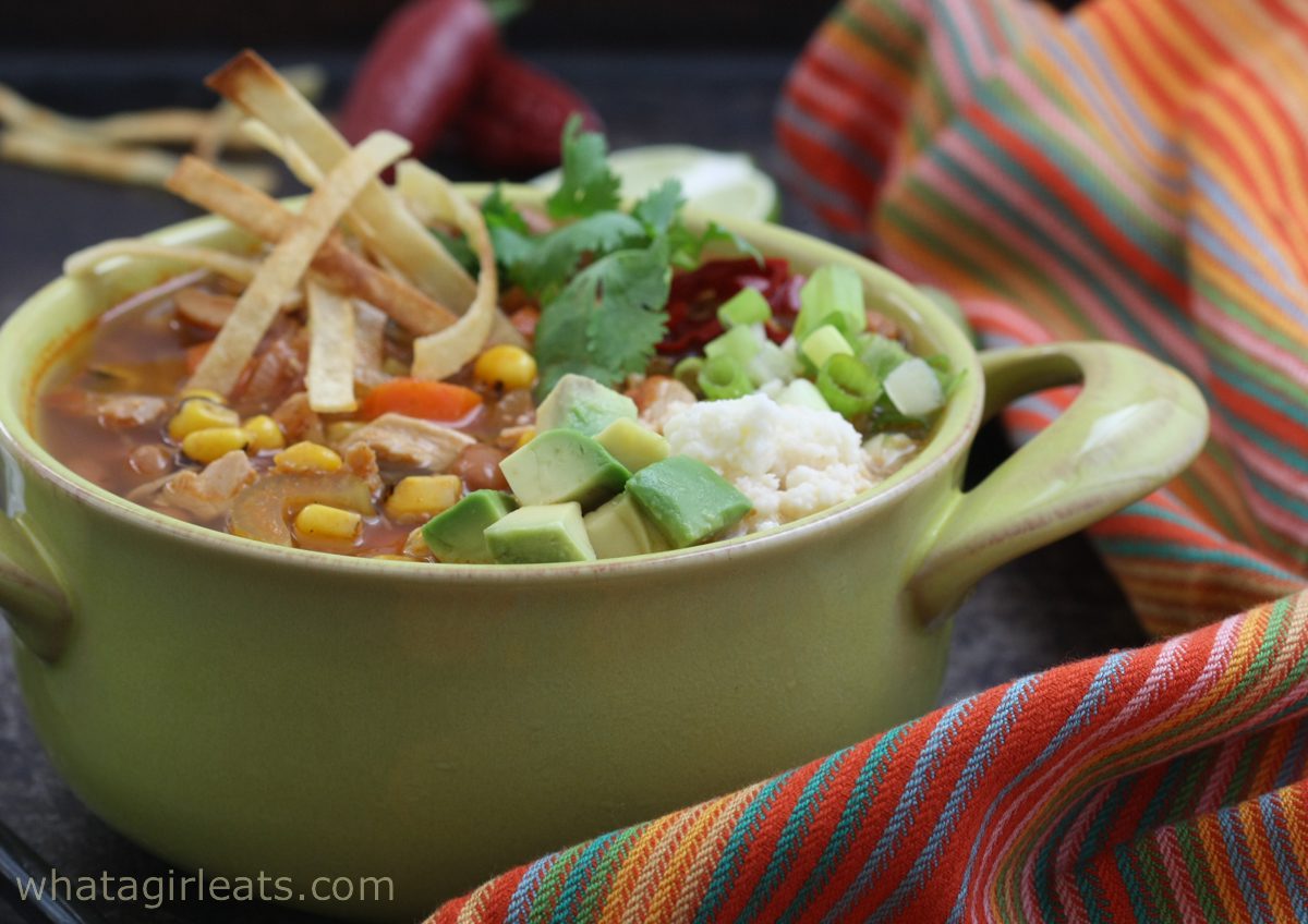 mexican chicken soup with striped cloth.