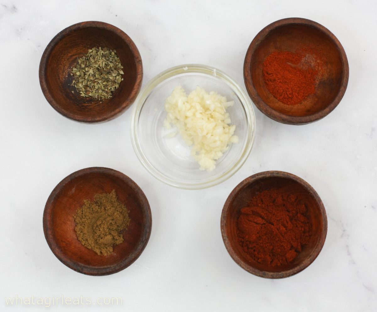herbs and spices in bowls.